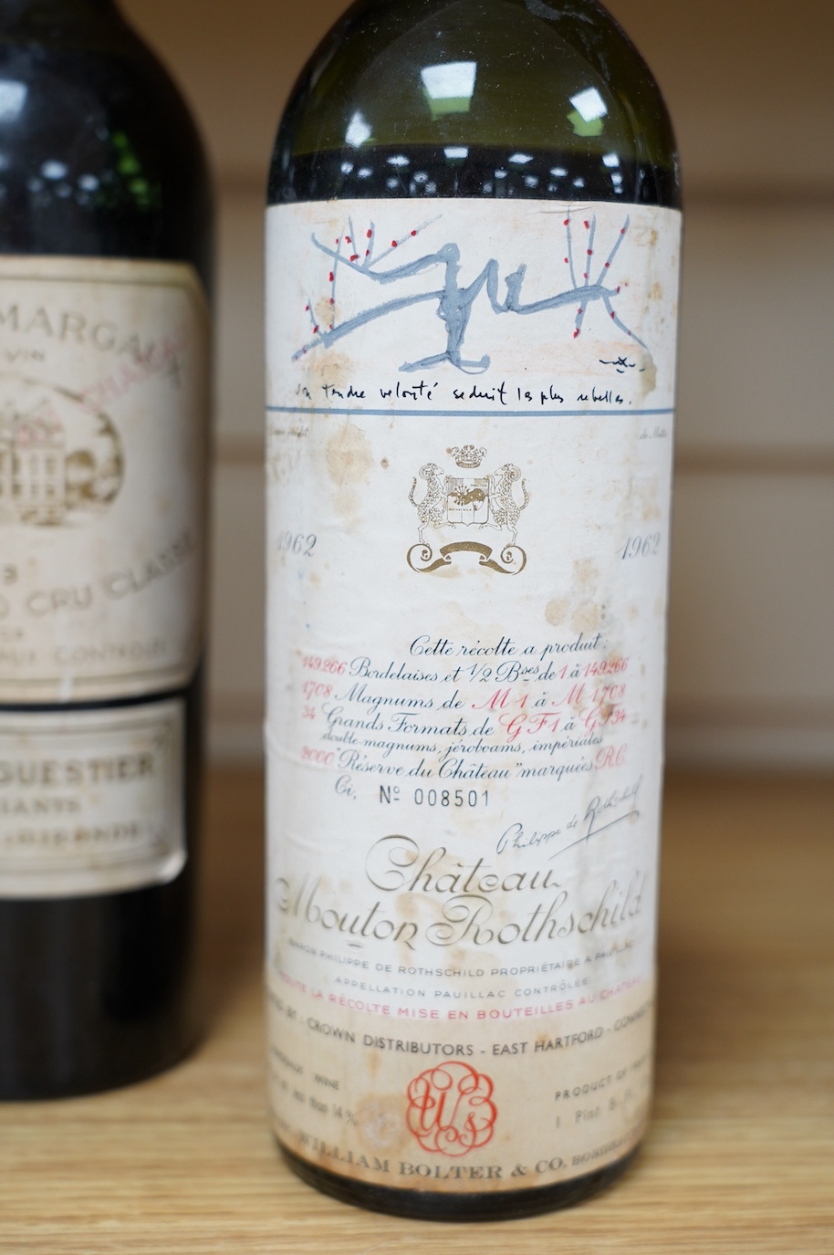 Four bottles of red wine; a Chateau Latour 1953, a Chateau Margaux 1953, a Chateau Mouton Rothschild, 1962, and a Chateau Rothschild 1952. Condition - fair to good, some foxing and peeling etc to labels